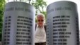 A man reads names on a monument to children who fall victim to the four-year siege of Sarajevo (1992-1995).