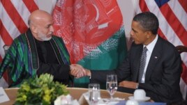 U.S. President Barack Obama (right) and his Afghan counterpart, Hamid Karzai, must also review and officially confirm the document.