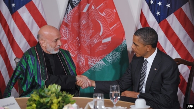 Afghan President Hamid Karzai (left)  with U.S. President Barack Obama (file photo)