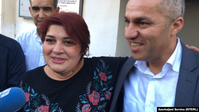 Khadija Ismayilova (left) talks to reporters upon her release from prison on May 25.