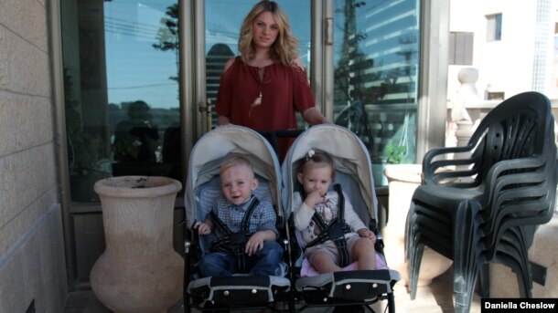 Alexandra Cohen (formerly Krasuk) and her two children in the village of Mount Gerizim.