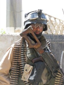 Iraq -- DO NOT USE; Iraqi soldier in al-Sadr City (PHOTO BY Richard Tomkins)