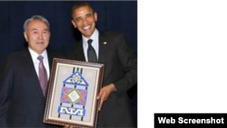 Kazakh President Nursultan Nazarbaev gives his U.S. counterpart Barack Obama the special gift in a frame.