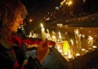 Opposition supporters light candles in solidarity with the people injured and arrested during last week's protests (epa)