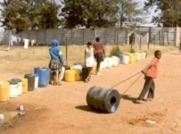 A child uses a Q-Drum to haul water in Zimbabwe (Courtesy Photo)