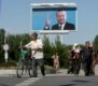 A billboard of President Karimov smiles over a street in Andijon