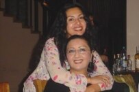 Nodira Hidoyatova (back) and her sister, Nigora, in Tashkent last year (RFE/RL)