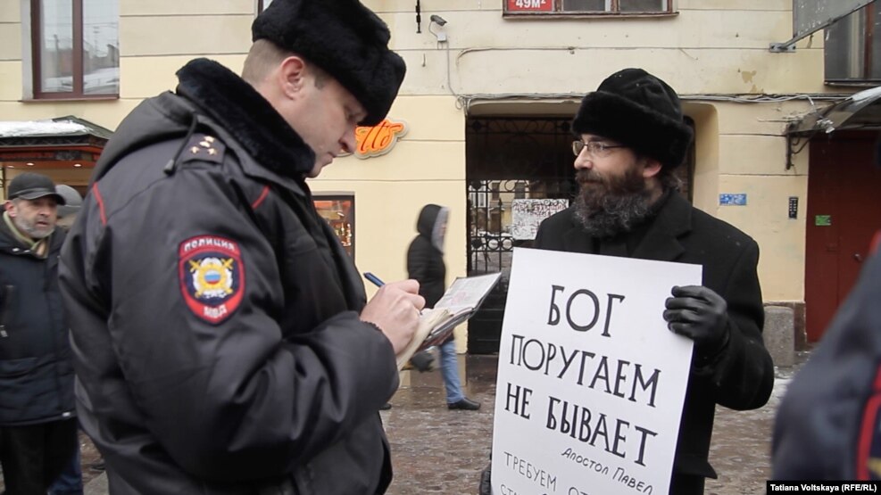 Police arrived at the site and took down the protesters' personal data.