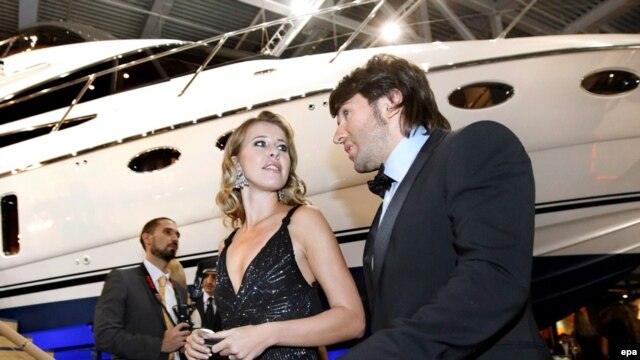 Ksenia Sobchak and TV celebrity Andrei Malakhov take part in the opening ceremony of the Millionaire Fair in Moscow in 2008.