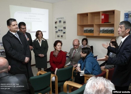 Armenia -- Prime Minister Tigran Sarkisian (L) and U.S. Ambassador Marie Yovanovitch (C) meet with beneficiaries of U.S. assistance provided under the Millennium Challenge Account program, 15Apr2011.