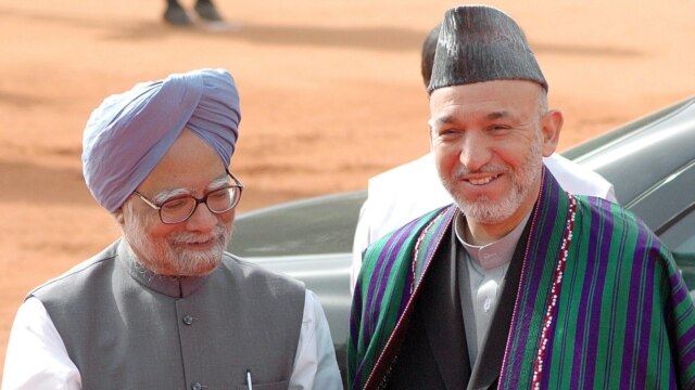 Prime Minister Singh (left) greeting Afghan President Hamid Karzai in New Dehli earlier this month (epa)