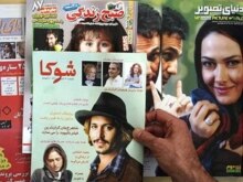 Iran -- A man reads an entertainment magazine in Tehran, 16Mar2008