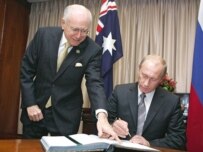 Australia's John Howard and Russia's Putin signed a controversial uranium deal in Sydney (ITAR-TASS)