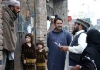 Census takers interview Afghan refugees earlier this year in Lahore, Pakistan