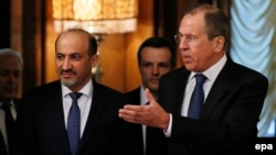 Russian Foreign Minister Sergei Lavrov (right) with the head of the Syrian National Coalition of Opposition and Revolutionary Forces, Ahmad al-Jarba, in Moscow on February 4.
