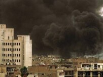 Smoke from an explosion in Baghdad today (AFP)