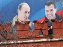 Russia - The pre-election poster with the portraits of President Vladimir Putin (L) and vice-premier and presidential candidate Dmitry Medvedev (R) is seen over the Kremlin wall in the center of Moscow, 29Feb2008