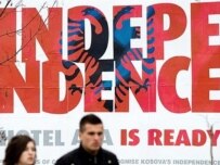 The message on a billboard in Pristina is clear (AFP)