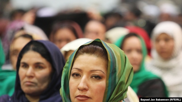 Delegates listen to Afghan President Hamid Karzai on the last day of the Loya Jirga in Kabul on November 19.
