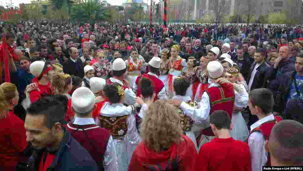 People celebrate in Tirana.