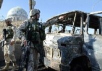 U.S. troops survey the aftermath of a car bomb in Baghdad (file photo) (AFP)