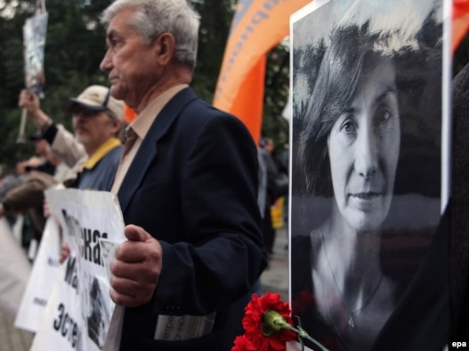 Demonstrators hold portraits of Natalya Estemirova during a rally in Moscow last year.