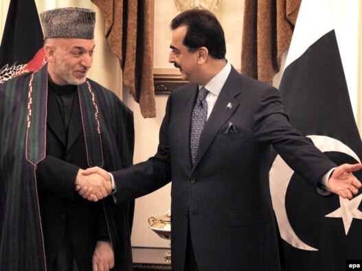 Pakistani Prime Minister Yousuf Raza Gilani (right) meets with Afghan President Hamid Karzai in Islamabad.