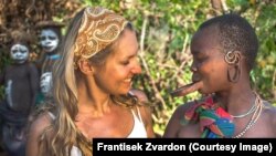 Ethiopia--Czech journalist Lenka Klicperova with a woman from the Suma tribe.