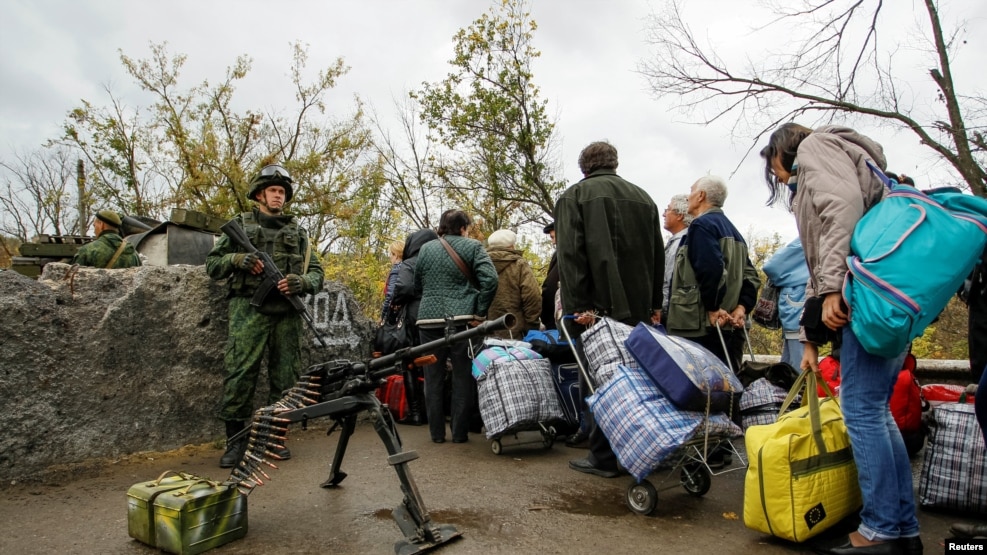 The report says separatist groups controlling parts of the Donetsk and Luhansk regions "continue to deprive people of their basic rights and of any effective mechanism for redress."