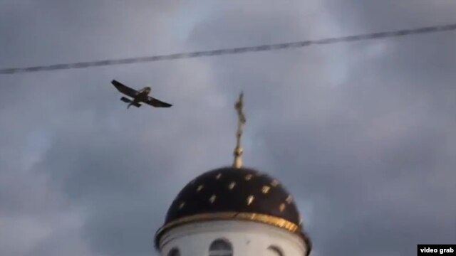 A grab from a YouTube video purporting to show Swede Tomas Mazetti in an airplane over Belarus dropping pro-free speech teddy bears on July 4.