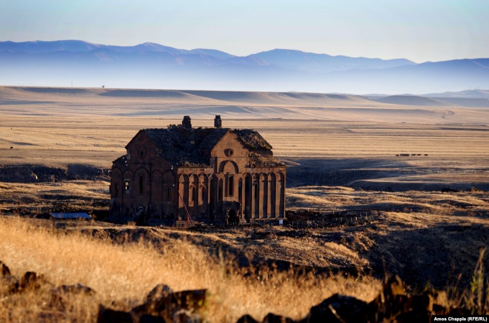Sun-scorched plains and the ruins of Ani Cathedral. A complex tug-of-war since its founding more than a millennium ago saw Ani variously controlled by Russia, the Ottoman Empire, and Armenia before finally being captured by the newly formed Turkish Republic in 1920. Ani was abandoned centuries ago, but it is treasured by Armenians today as a symbol of former splendor.