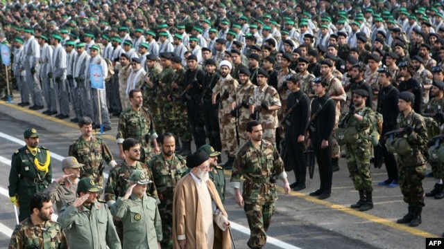 Iranian Supreme Leader Ayatollah Ali Khamenei (center) walks with Iranian commanders past Basij militia ranks in Tehran. (file photo)