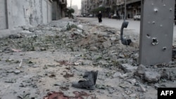 Blood and debris on a sidewalk following a mortar attack in the northern Syrian city of Aleppo on November 6.