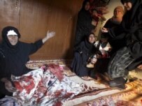 Women in Baghdad grieve over a dead child, November 21 (epa)