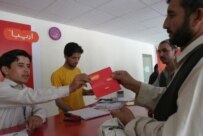 A Kabul resident purchases a SIM card for Afghanistan's third cellular-phone provider in July (epa)