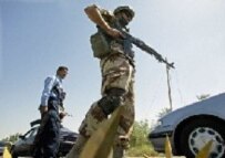 Iraqi and U.S. forces guarding a checkpoint (file photo)