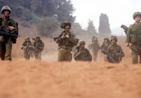 Israeli soldiers take up positions inside Lebanon on August 12 (epa)