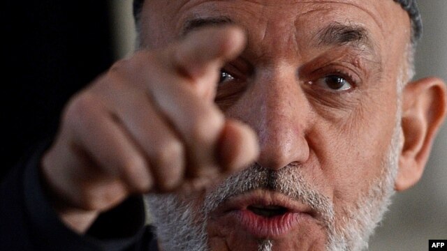 Afghan President Hamid Karzai gestures during a joint press conference with NATO Secretary-General Anders Fogh Rasmussen in Kabul on March 4.