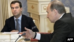 Russian officers claim that Vladimir Putin (right) had to push then-President Dmitry Medvedev to take action after the Georgian Army advanced into South Ossetia in 2008.