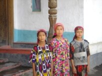 Many young Tajik girls wear head scarves, though wearing them to school is now banned in Tajikistan (file photo) (RFE/RL)