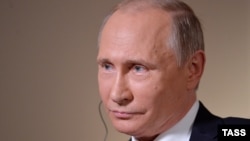 Russian President Vladimir Putin looks on during an interview with Bloomberg in Vladivostok on September 1.