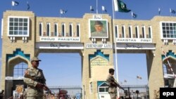 Pakistani paramilitary soldiers stand at a checkpoint in South Waziristan in October.