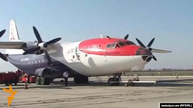 Armenia - An Antonov-12 cargo plane carrying humanitarian aid for Syrians prepares to take off from Yerevan airport, 15Oct2012.