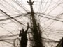 An electrician checks the wires leading to a block of flats in Baghdad
