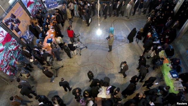 Men and women wait in separate lines in a mosque in south Tehran on March 2 to vote in the Iranian parliamentary elections.