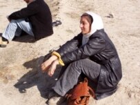 Radio Free Afghanistan journalist Safia Hasass covering a Kabul prison uprising in February (RFE/RL)