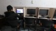 A man browses the Internet at a cafe in central Tehran in January after Iran officially launched its cyberpolice unit to confront Internet crimes and counter social networks that spread "espionage and riots," according to its police chief.