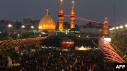 Shi'ite Muslim pilgrims gather near the shrine of Imam Abbas as they prepare to celebrate the festival of Ashura in Karbala on November 12. The Ashura celebration is a traditional target of extremist bombings.