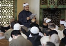 U.K. -- Muslims praying/central London