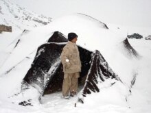 Afghanistan -- An Afghan boy enjoys snowfall in Herat, 15Jan2008